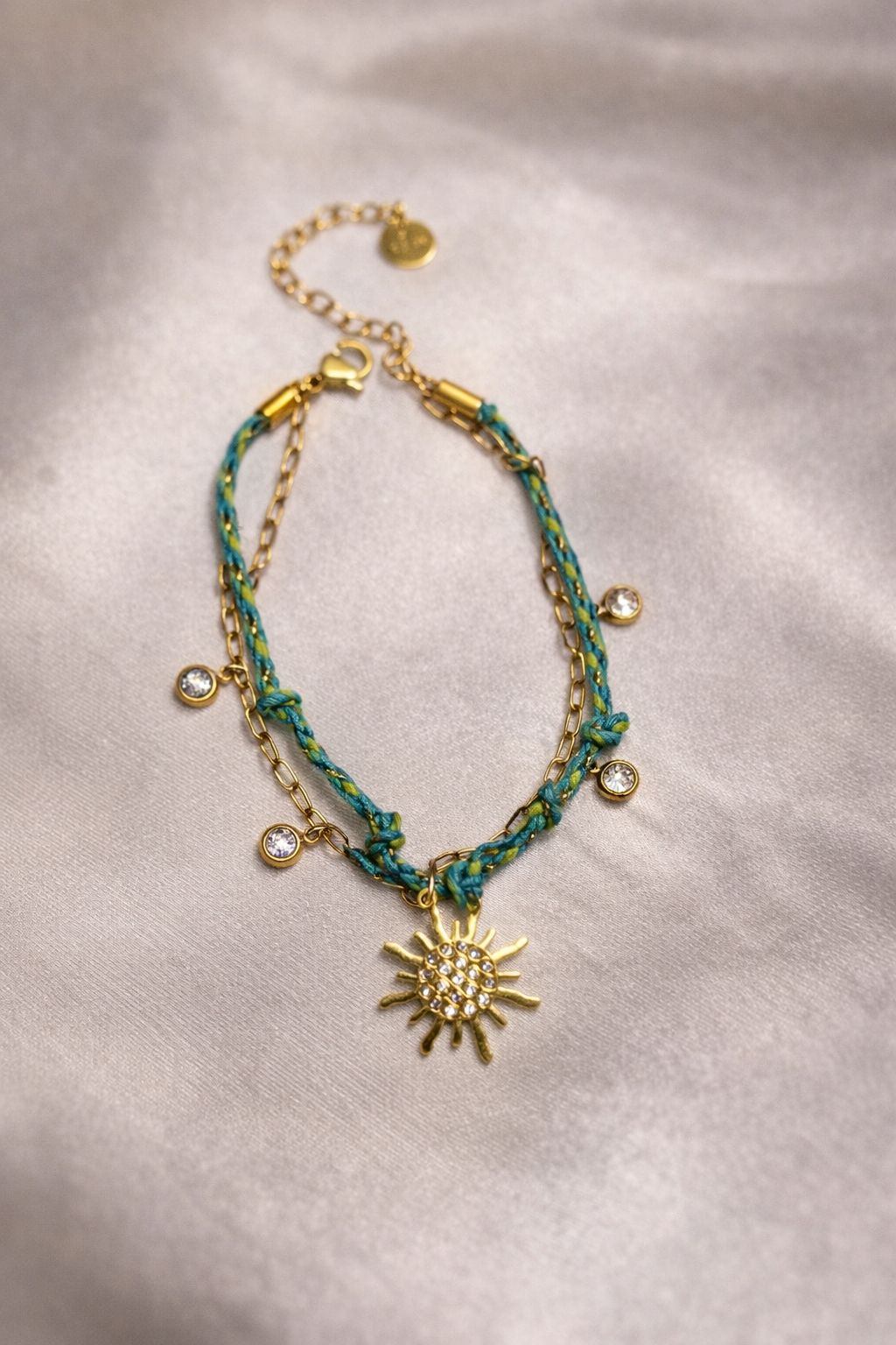 Bohemian Celestial Sun Charm Bracelet – Layered Gold Chain & Teal Braided Cord with Sparkling Crystals
