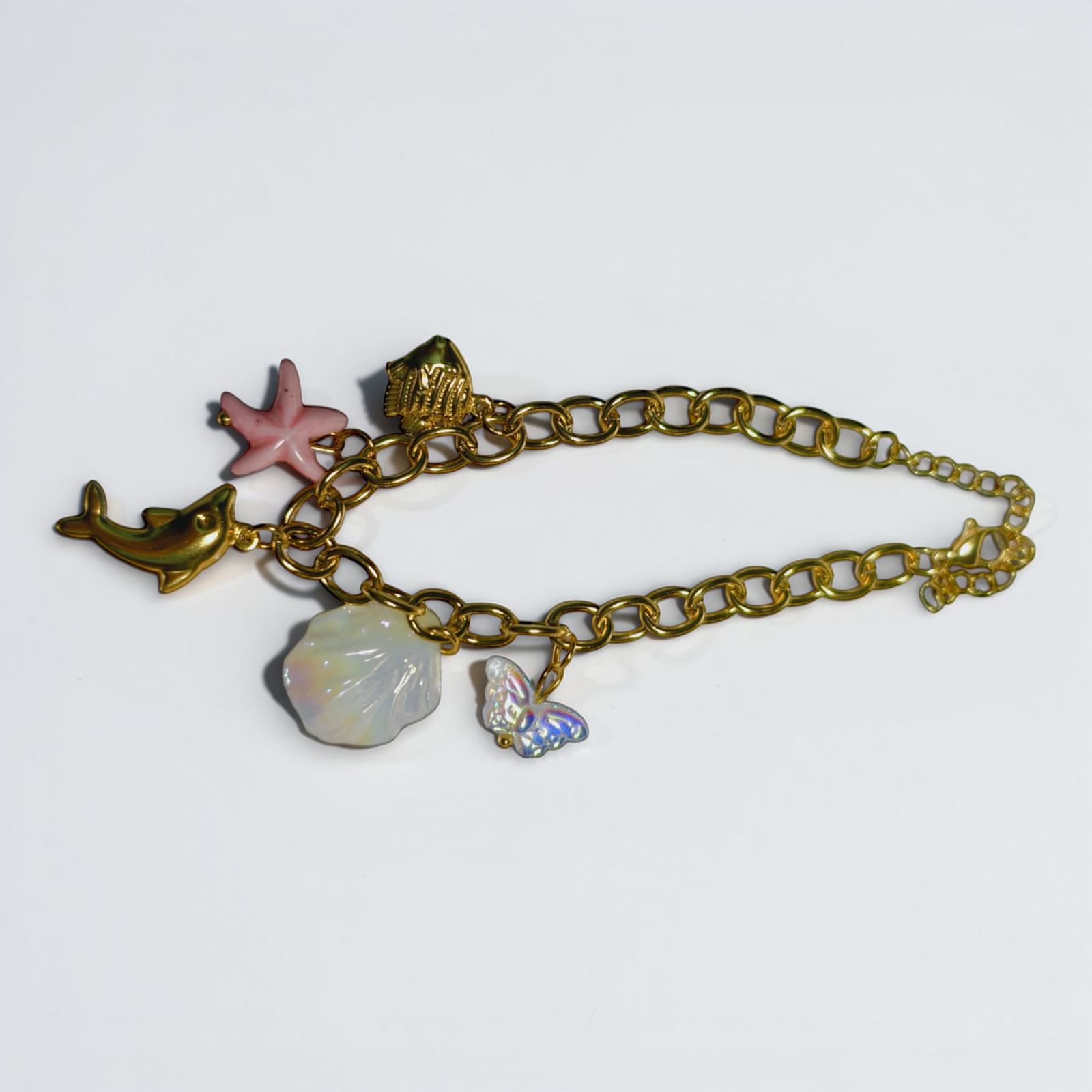 Gold Coastal Charm Bracelet – Mermaidcore Sea Life Jewelry with Dolphin, Starfish, and Shell Charms