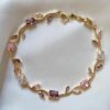 Elegant gold-toned bracelet with pink and crystal stones—perfect for everyday wear and special occasions.