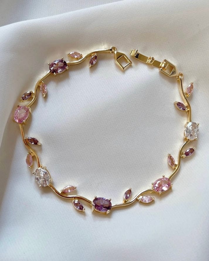Elegant gold-toned bracelet with pink and crystal stones—perfect for everyday wear and special occasions.
